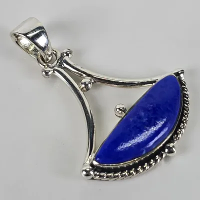 Sterling silver pendant featuring a fan-shaped design set with a polished, half-moon lapis lazuli cabochon and rope-twist border details.