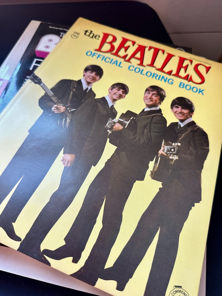 Vintage 1964 The Beatles Official Coloring Book, featuring a yellow cover with a photo of the band members in suits.