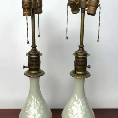 Pair of vintage celadon porcelain lamps with "pate sur pate" floral decoration