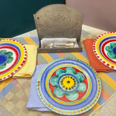 Three Desimone Italian Plates, Linens, Flatware & Wall Rack
