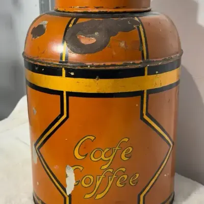 Vintage orange and black metal coffee canister