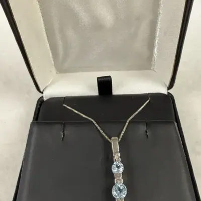925 sterling silver three-stone graduated blue topaz drop pendant necklace