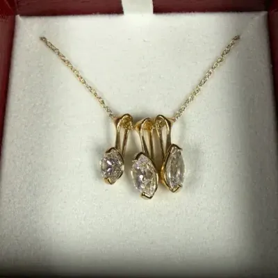 14k gold multi-stone slide pendant necklace featuring clear, marquise-cut stones
