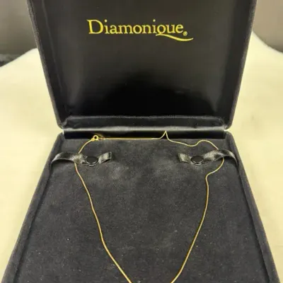 Diamonique 14K yellow gold necklace featuring a central triangular or trillion-cut solitaire pendant