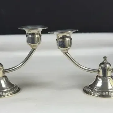 Pair of vintage silver-tone 2-light candelabra candle holders with curved arms and weighted bases