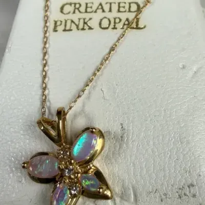 10k yellow gold flower pendant necklace featuring pear-shaped created pink opal petals accented with
