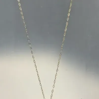 925 multi-tone curved cross pendant necklace featuring a small cluster of accent stones