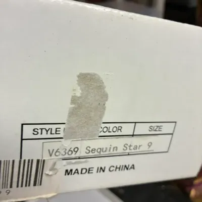 A white shoe box label showing style number V6369, color Sequin Star, and size 9.