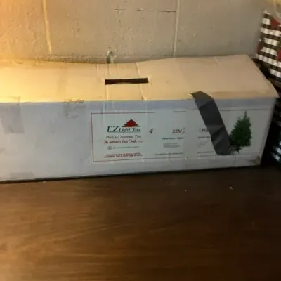 EZ Light Tree pre-lit artificial Christmas tree by Santa's Best Craft, in its original cardboard box.