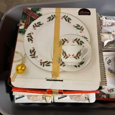 Vintage Christmas-themed porcelain dinnerware set by Creative Regency, featuring a holly and berry motif with gold trim, in its original...