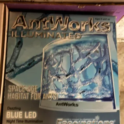 AntWorks Illuminated space-age habitat for ants by Fascinations, featuring blue LED night time illumination, in its original box.