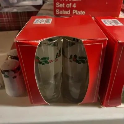 Vintage Christmas glassware set featuring a holly and berry motif, packaged in its original red cardboard box.