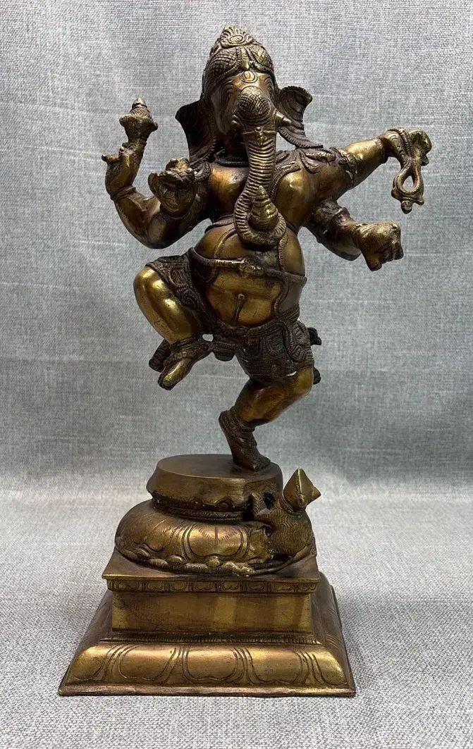 Brass Statue depicting Lord Ganesha in a dynamic dancing posture, commonly known as Nrit