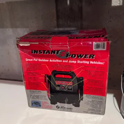 Schumacher Instant Power portable automotive jump starter and DC power supply, in its original red retail box showing some wear, made in...