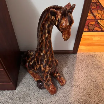 Vintage Italian ceramic floor statue of a reclining giraffe, featuring a rich brown and amber drip glaze finish, likely mid-century...