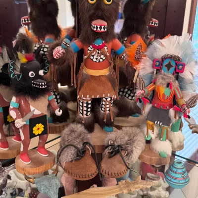 Native American Hopi Kachina Dolls and Collectibles: A collection of hand-carved Hopi Kachina dolls, including a Buffalo Dancer and a Sun...