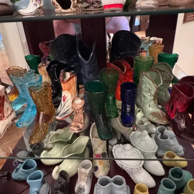 Vintage ceramic and glass boot and shoe planters, featuring a variety of colorful mid-century styles, Fenton art glass, and hand-painted...
