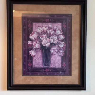 Framed floral art print titled "Tulips in Vase" by artist Paula Vaughan, featuring a bouquet of pink and white tulips in a...
