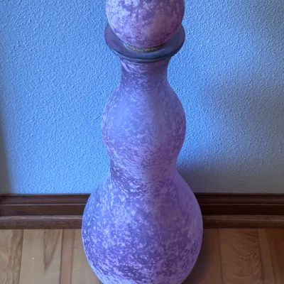 Vintage Blenko glass decanter in a mottled purple finish, featuring a double-lobed gourd shape and matching spherical stopper,...