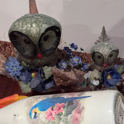 Vintage Gurley-style novelty owl candles nestled in a faux driftwood floral arrangement, paired with a hand-painted decorative glass...