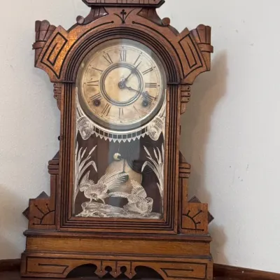 Antique E. Ingraham & Co. 'Grecian' shelf clock, made in Bristol, Connecticut, featuring a carved walnut gingerbread case,...