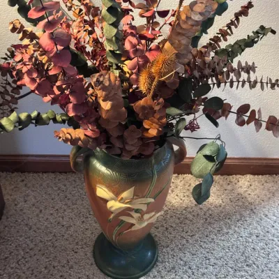 Roseville Pottery Daylily double-handled vase, shape 114-15, made in the USA circa 1944, featuring embossed yellow lilies on a terra...