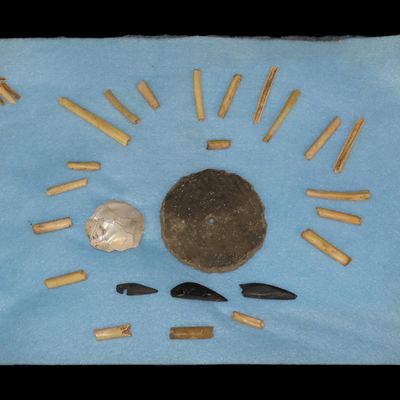 12" x 8" Riker Display Frame Containing Bone Beads, Pottery Whorl, and Pendant, Kentucky