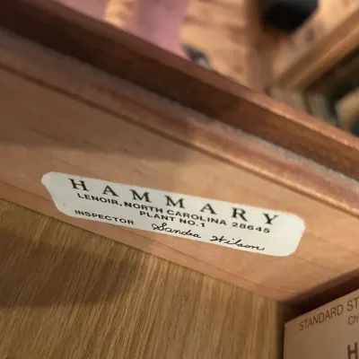 Hammary furniture manufacturer label inside a wooden drawer, indicating production in Lenoir, North Carolina.