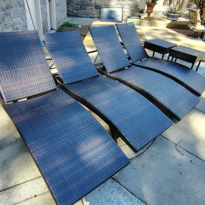 Four Pool Side Lounge Chairs And Side Tables