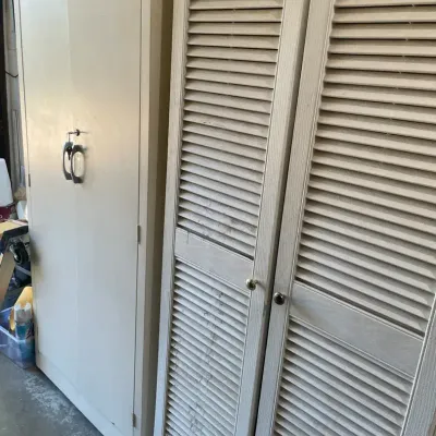 Locking White Metal Storage Cabinet and White Wood/ Laminate Storage Cabinet