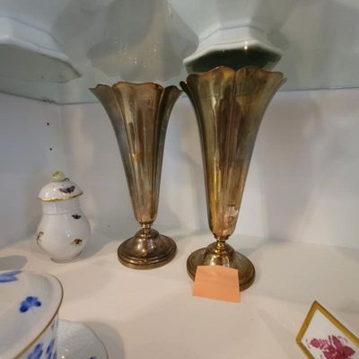 Pair of vintage silver-plated trumpet vases with scalloped rims, showing heavy tarnish and patina.