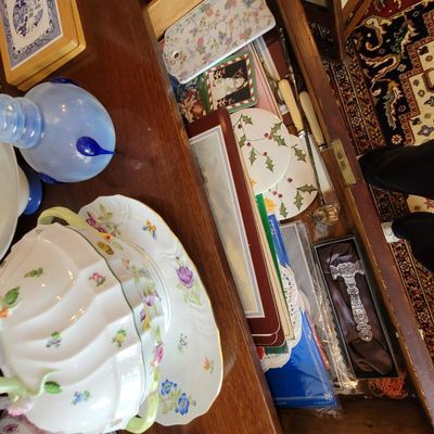 Assorted vintage tableware and collectibles, including a floral porcelain tureen, a blue art glass vase, and holiday-themed plates...