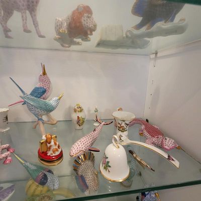 Collection of Herend porcelain figurines and decorative items, featuring hand-painted fishnet patterns on animal figures including birds,...