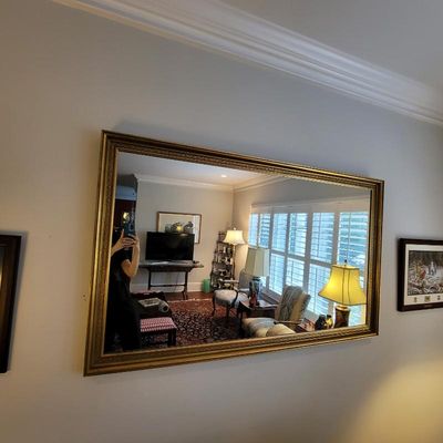 Large rectangular wall mirror featuring a classic gold-finished frame with ornate beaded and textured detailing.