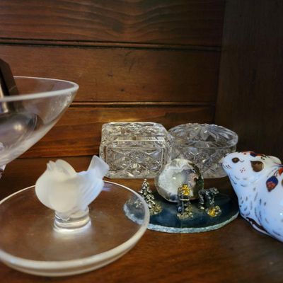 Assortment of small decorative items, including cut glass trinket boxes, a frosted glass bird figurine on a stand, a miniature mining...