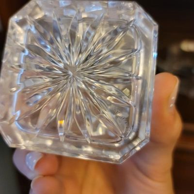Waterford crystal piece showing the acid-etched maker's mark on the starburst-cut base.
