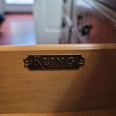 Vintage Kling Mayville, New York brass maker's mark plaque mounted inside a wooden furniture drawer.