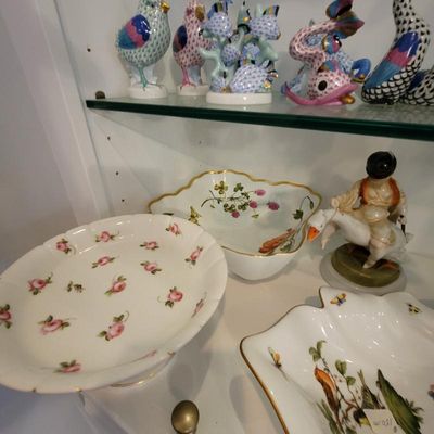 Collection of fine porcelain items including a Herend-style hand-painted floral bowl, a rose-patterned pedestal dish, and a figurine of a...