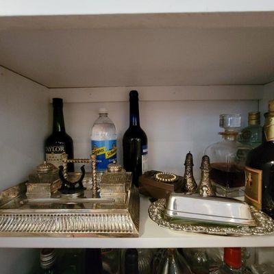 Vintage silver-plated desk stand with dual inkwells, displayed alongside a silver-plated butter dish, salt and pepper shakers, and...