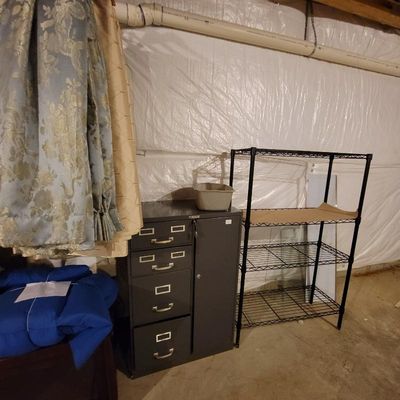 Vintage gray metal filing cabinet with four drawers and a side compartment, shown next to a black wire shelving unit.