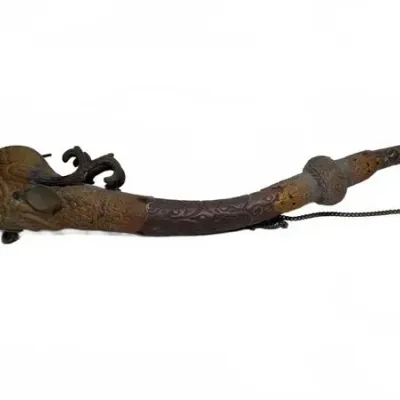 Antique Asian dragon-themed pipe, featuring an intricately carved wooden or composite body with a metal dragon head bowl and attached chain.