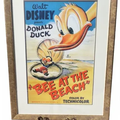 Framed vintage Walt Disney theatrical poster for the 1950 Donald Duck cartoon "Bee at the Beach," presented in a matted...