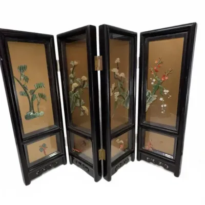 Vintage Chinese four-panel miniature table screen featuring carved jade and hardstone floral motifs on a gold background, set in a black...