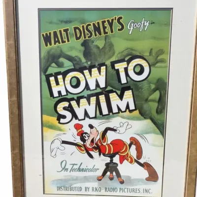 Framed vintage poster for Walt Disney's Goofy in "How to Swim," distributed by RKO Radio Pictures, presented in a...