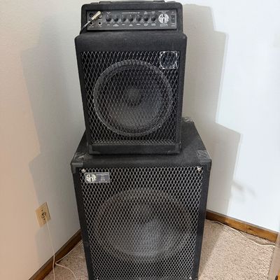 SWR bass amplifier setup including a combo amp stacked on an SWR 'The Big Ben' subwoofer cabinet, featuring carpeted enclosures...