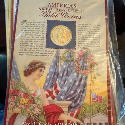 Sale Photo Thumbnail #224: America's Most Beautiful Gold Coins informational display card featuring the Small Eagle $10 Gold Piece (1795-1797), preserved in a plastic sleeve.