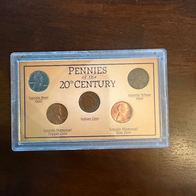 Sale Photo Thumbnail #231: "Pennies of the 20th Century" coin collection set in a protective plastic display case, featuring a Lincoln Steel Cent, Lincoln Wheat Cent, Indian Cent, Lincoln Memorial Copper Cent, and Lincoln Memorial Zinc Cent.