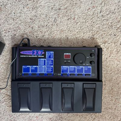 Vintage DOD FX7 Guitar FX Processor and Preamp multi-effects pedal, featuring four foot switches and a digital display.