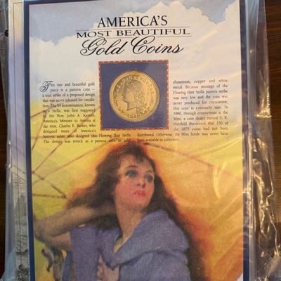 Sale Photo Thumbnail #227: America's Most Beautiful Gold Coins informational card featuring the 1879-1880 Flowing Hair $4 Gold Piece, preserved in a plastic sleeve.