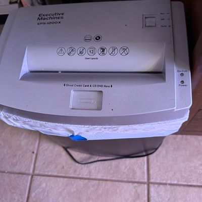 Sale Photo Thumbnail #154: Executive Machines EPS-1200X paper shredder, featuring a 12-sheet capacity and dedicated slots for credit cards and CDs/DVDs.
